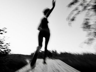 Abstract motion blur of a person exercising indoors.